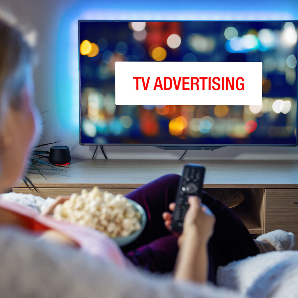 Concept,Of,Advertising,On,Television,,Woman,Looking,At,Ad,While